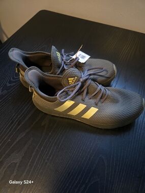 adidas Women’s Gray Athletic Sneakers with Gold Stripes